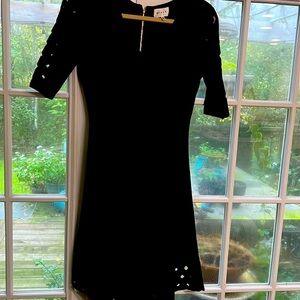 Milly black knit dress with cut out sleeves and hem.